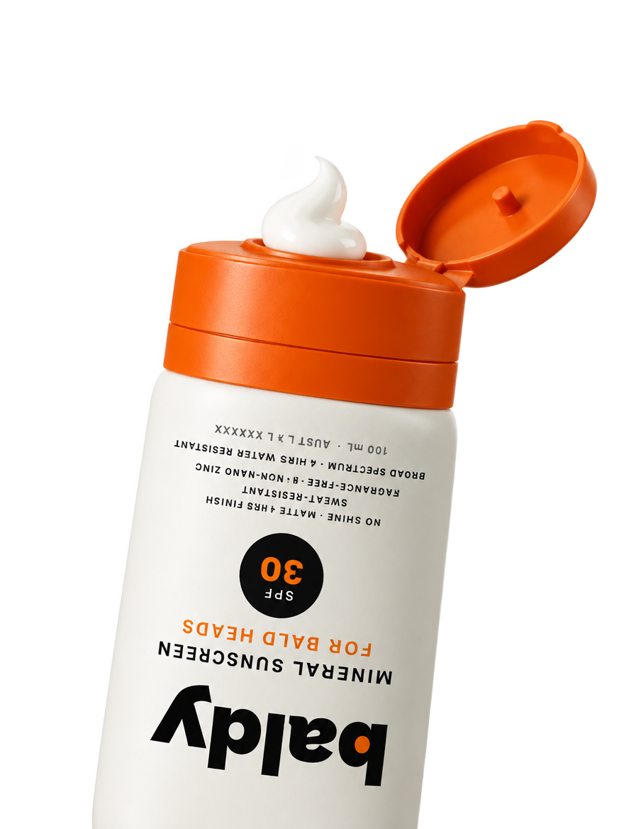 Open BALDY SPF 30 mineral sunscreen bottle with cream